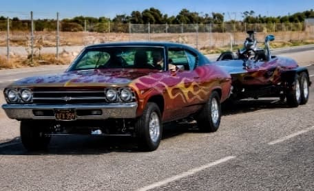 Harris Kern's customized Chevelle towing his speed boat